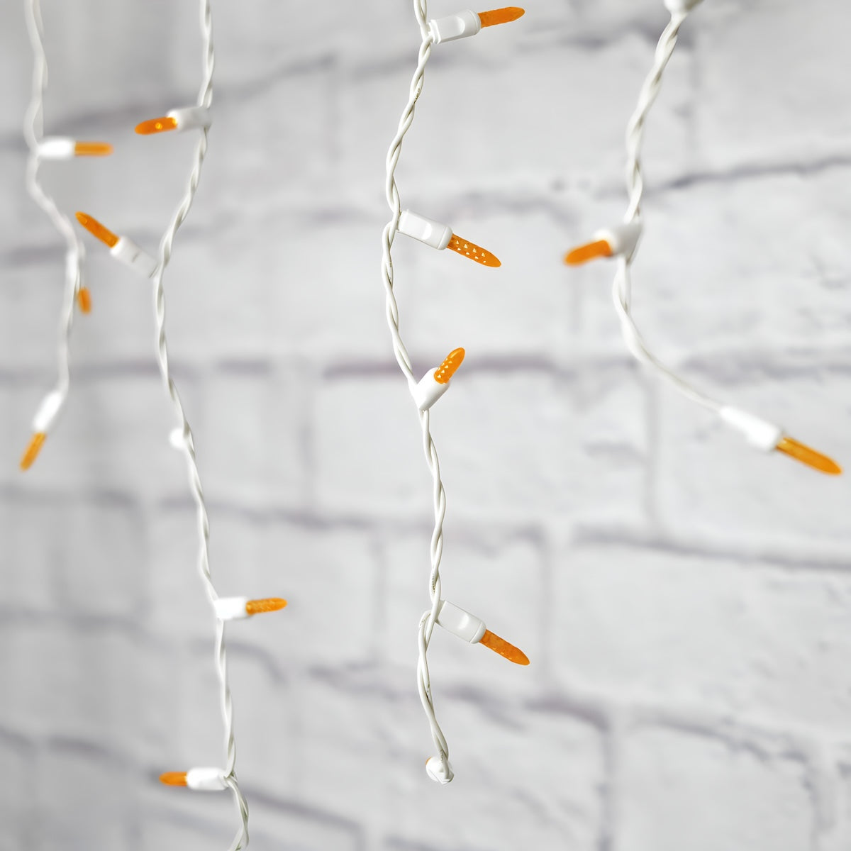 M5 Orange LED Icicle Lights 70 Bulbs 7.5ft Long White Wire - Christmas Lights