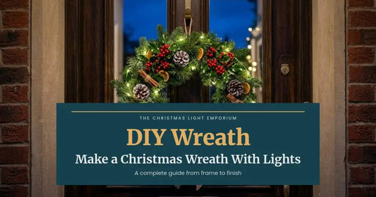Evergreen wreath with warm white lights, pinecones and red berries on a front door. Branded title card from The Christmas Light Emporium reads: DIY Wreath — Make a Christmas Wreath With Lights.