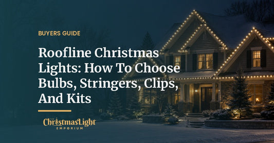 A two-story craftsman home at night after a light snow, every eave and gable outlined in a straight, evenly spaced row of warm white C9 LED Christmas bulbs, with softly lit evergreens in the front yard
