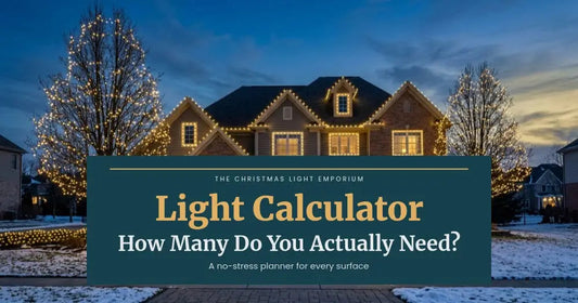Two-story home with warm white roofline lights and light-wrapped trees at dusk. Branded title card from The Christmas Light Emporium reads: Light Calculator — How Many Do You Actually Need?.