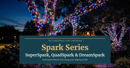 Tree trunks and branches wrapped in multicolor lights at night. Branded title card from The Christmas Light Emporium reads: Spark Series — SuperSpark, QuadSpark & DreamSpark.