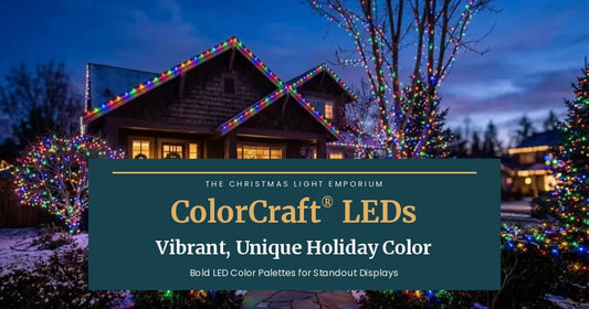 Craftsman home at dusk with multicolor LED lights on the roofline, wrapped trees and shrubs. Branded title card from The Christmas Light Emporium reads: ColorCraft® LEDs — Vibrant, Unique Holiday Color. Bold LED Color Palettes for Standout Displays.
