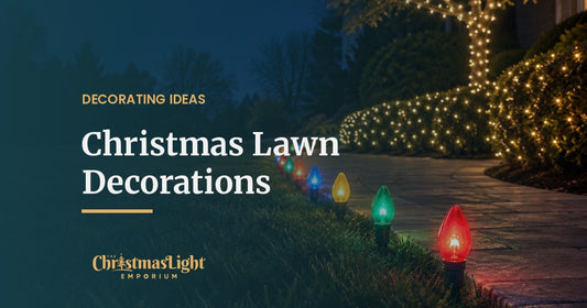 A curving front walkway at dusk lined with multicolor C9 LED bulbs at ground level, beside shrubs covered in warm white net lights and a tree trunk wrapped in warm white mini lights