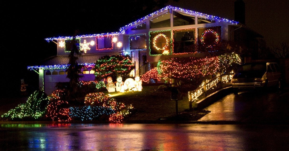 A house glowing with colorful LED Christmas lights