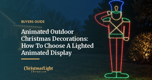 Large LED-outlined animated saluting toy soldier yard display glowing in a front lawn at night with a warm white lit roofline behind