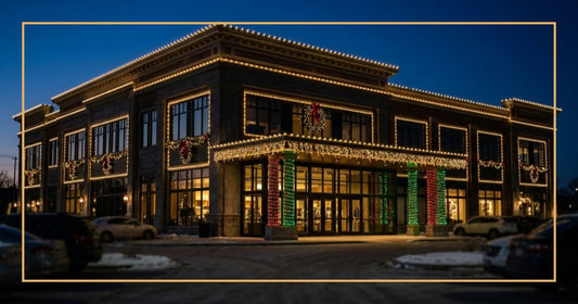 Commercial building exterior decorated with professional Christmas lights at twilight