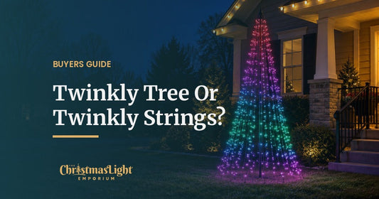 A multicolor app-controlled Twinkly light show pole tree glowing in red, purple, teal and green beside the front porch of a house at night, with warm white C9 lights on the roofline