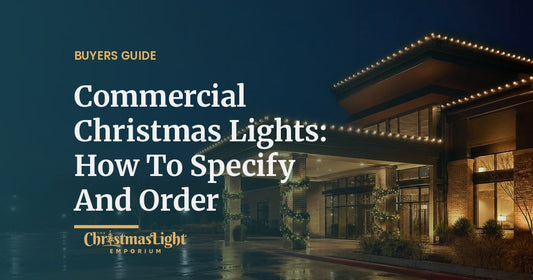 Commercial hotel entrance canopy outlined in warm white C9 Christmas lights at night