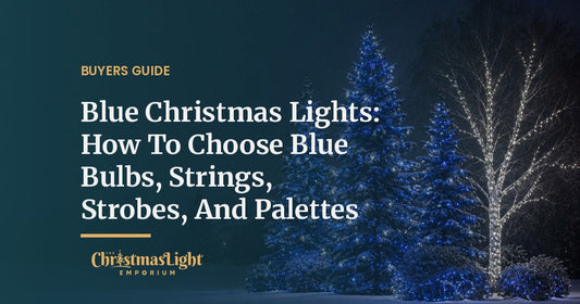Three snow-covered evergreen trees wrapped in blue and cool white LED Christmas lights beside a birch tree wrapped in cool white mini lights, with shrubs in blue net lights, on a snowy night