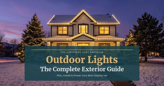 Title image of a two-story home at twilight with warm white LED Christmas lights on the roofline, wrapped columns, and lit bushes and trees. Image text reads: Outdoor Lights / The Complete Exterior Guide / Plan, Install & Power Your Best Display Yet