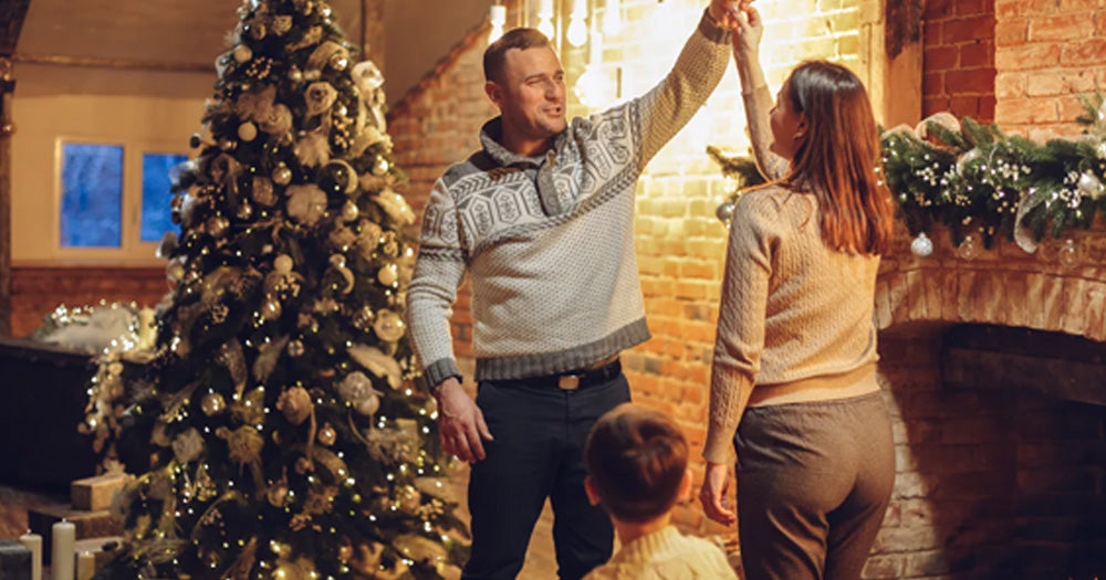 Picture of a family decorating a Christmas tree