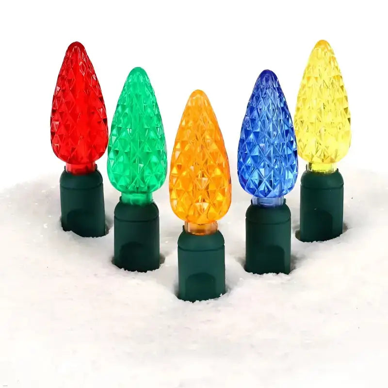 Multiple strings of 70-count C6 multicolor LED Christmas lights with 4-inch spacing on green wire, showing the small round strawberry-shaped lens style in vibrant red, green, blue, orange and white colors