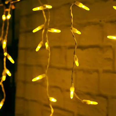 Gold 70-count M5 LED icicle Christmas lights on white wire
