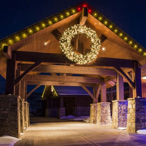 a bridge decorated with wreaths and lights