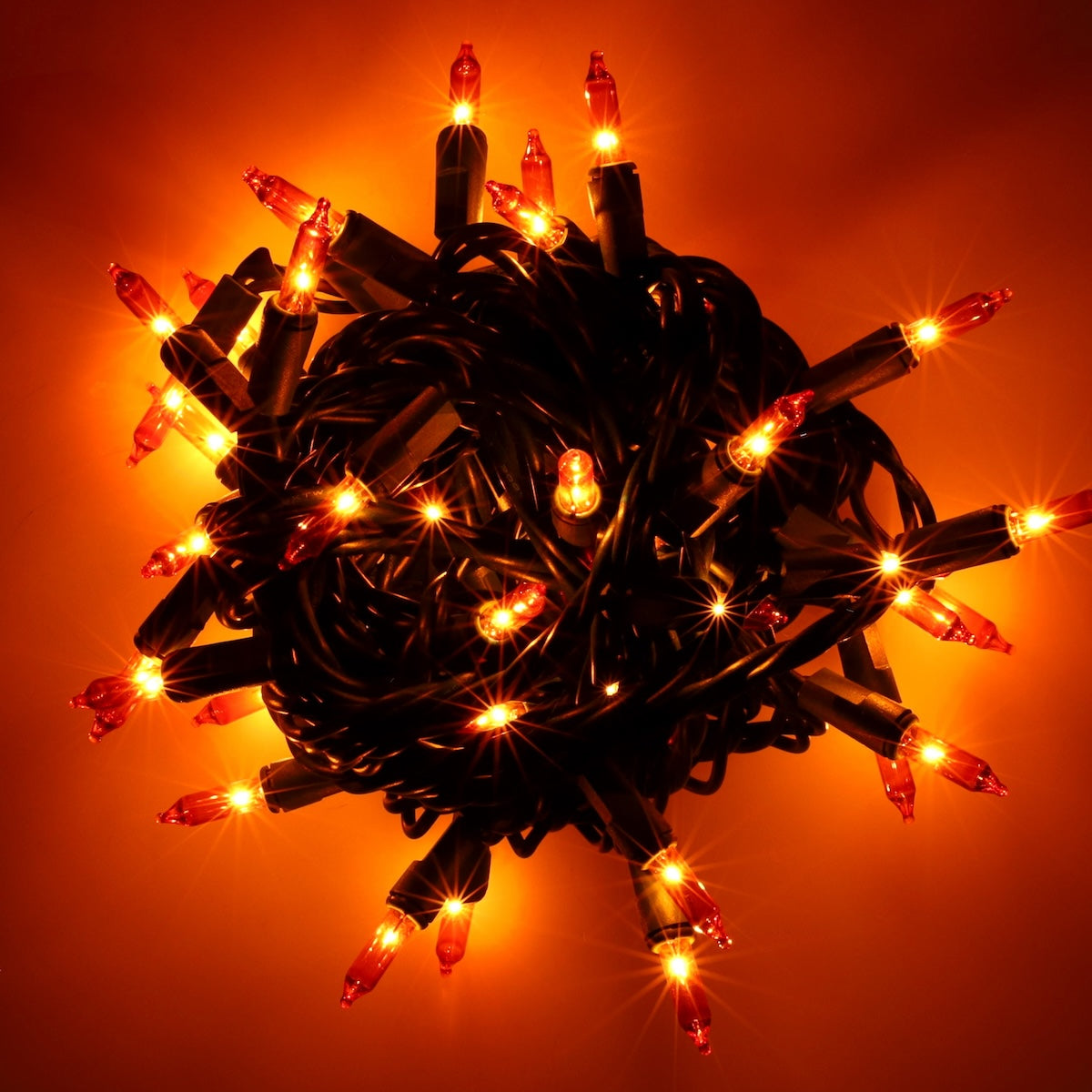 50 Orange Incandescent Mini Lights, Green Wire, 6" Spacing [CLOSEOUT] - The Christmas Light Emporium