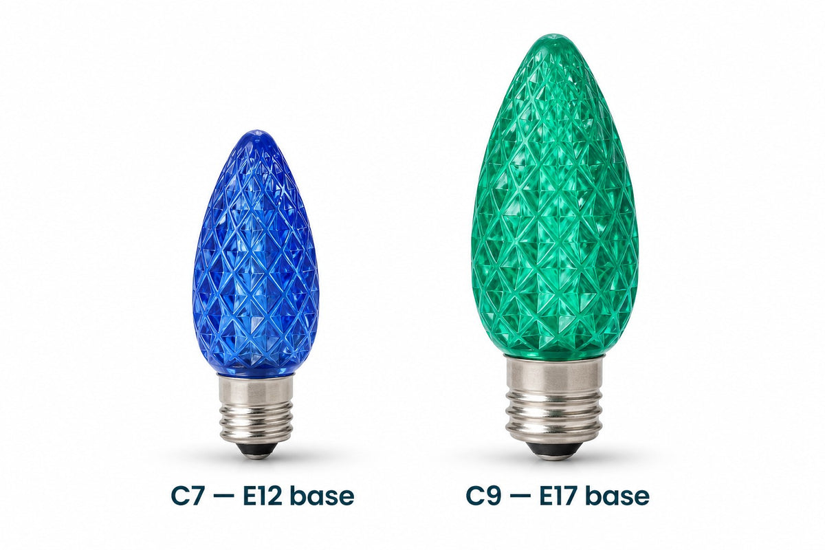 Side by side size comparison of a smaller blue C7 LED bulb with E12 base and a larger green C9 LED bulb with E17 base