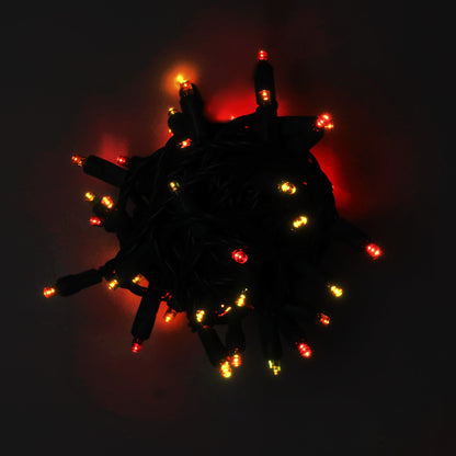 Bundled 50-light ColorCraft® Harvest 5mm LED string lit in red, orange, and gold against a dark background