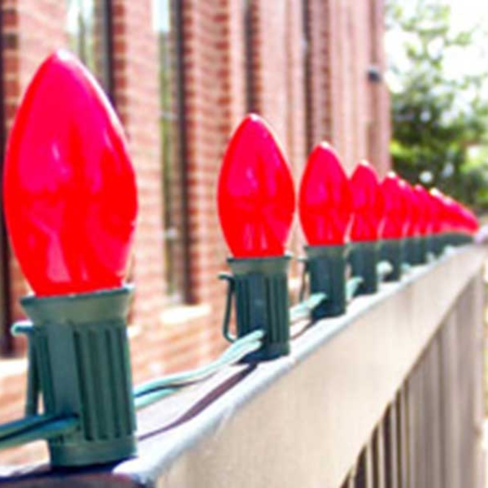 Close-up of red C9 bulbs in Lite-Netics magnetic sockets snapped to a metal roof edge