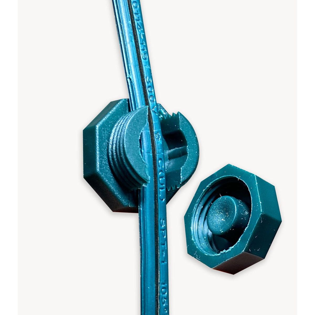 Green Lite-Netics magnetic wire clamp with the threaded cap removed showing the clamp on green wire