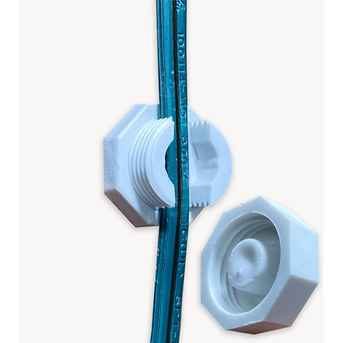 White Lite-Netics magnetic wire clamp with the threaded cap removed