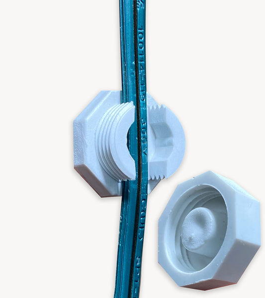 White Lite-Netics magnetic wire clamp with the threaded cap removed